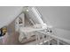 Cozy attic bedroom with natural light from a skylight and an ensuite door at 1136 N Logan St # 8, Denver, CO 80203