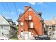 Back of brick building with fire escape at 1136 N Logan St # 8, Denver, CO 80203