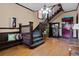 Elegant entryway with rich wood staircase, bench seating, and hardwood floors at 1136 N Logan St # 8, Denver, CO 80203
