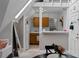 Efficient kitchen showing wood cabinets, white appliances, and breakfast bar under a skylight at 1136 N Logan St # 8, Denver, CO 80203