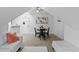 Relaxing living room with a white sofa, dining table, vintage ceiling fan and a painting on the wall at 1136 N Logan St # 8, Denver, CO 80203