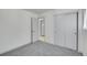 This bedroom features neutral-colored walls, carpeted floors, and a closet at 328 Quay St, Lakewood, CO 80226