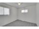 A well-lit bedroom offers two windows that provide plenty of natural light at 328 Quay St, Lakewood, CO 80226