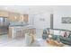 Open floorplan with modern kitchen, stainless steel appliances, and a cozy living room with comfortable furniture at 328 Quay St, Lakewood, CO 80226