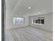 Spacious living room featuring modern vinyl floors, a window, and neutral paint at 328 Quay St, Lakewood, CO 80226