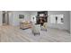 Inviting living room with stone fireplace, neutral furnishings, and wood floors, creating a cozy atmosphere at 328 Quay St, Lakewood, CO 80226