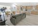 Open-concept living room features a modern kitchen with stainless steel appliances and a spacious seating area at 328 Quay St, Lakewood, CO 80226