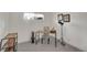 A functional home office featuring a modern wooden desk, chair, and ample natural light at 328 Quay St, Lakewood, CO 80226