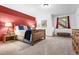 Bedroom with a wooden bed frame, side tables, and rustic decor at 6150 Bluebell Ln, Evergreen, CO 80439