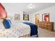 Bedroom features natural wood furniture, a window with a view, and a relaxing atmosphere at 6150 Bluebell Ln, Evergreen, CO 80439