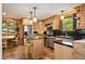 Well-equipped kitchen with stainless steel appliances, granite countertops, and breakfast bar at 6150 Bluebell Ln, Evergreen, CO 80439