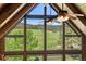 Spacious Living Room with vaulted ceilings, large windows and scenic views at 6150 Bluebell Ln, Evergreen, CO 80439