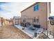 Backyard patio with fire pit, bench, storage box, and hot tub with a gazebo at 1788 Taos St, Brighton, CO 80603