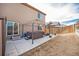 The backyard patio includes a gazebo-covered hot tub and low-maintenance landscaping at 1788 Taos St, Brighton, CO 80603