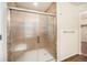 Bathroom with glass shower door and wood flooring at 1788 Taos St, Brighton, CO 80603