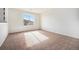Well-lit bedroom featuring a window and neutral carpet at 1788 Taos St, Brighton, CO 80603