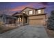 Two-story house with a brown facade, stone accents, and a two-car garage at 1788 Taos St, Brighton, CO 80603