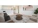 Cozy living room with neutral tones, plush seating, and view of a bright, airy room with white walls at 1788 Taos St, Brighton, CO 80603