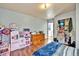 Bedroom featuring plenty of furniture, decor, and storage at 1841 Ruth Dr, Thornton, CO 80229