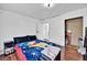 Bedroom showcases wood floors, a comfortable bed, and a closet with ample storage space at 1841 Ruth Dr, Thornton, CO 80229