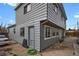 Home exterior reveals a well-maintained gray siding and a practical side entrance at 1841 Ruth Dr, Thornton, CO 80229