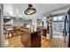Open concept kitchen with an island, bar and hardwood floors at 1841 Ruth Dr, Thornton, CO 80229