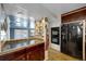 Kitchen with a breakfast bar, stainless appliances and plentiful cabinet space at 1841 Ruth Dr, Thornton, CO 80229