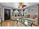 Inviting living room with hardwood floors, comfortable seating, and ample natural light at 1841 Ruth Dr, Thornton, CO 80229