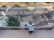 View of the landscaped backyard with rock garden and snow from the deck at 2305 Prospect Ln, Broomfield, CO 80023