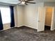 Bedroom featuring plush carpet, ceiling fan, and adjacent closet at 2305 Prospect Ln, Broomfield, CO 80023
