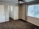 Bedroom featuring plush carpet, a window, and closet access at 2305 Prospect Ln, Broomfield, CO 80023