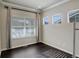 Cozy bedroom with hardwood floors, three windows allowing natural light, and neutral paint at 2305 Prospect Ln, Broomfield, CO 80023