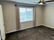 Neutral bedroom featuring plush carpet and window with natural light at 2305 Prospect Ln, Broomfield, CO 80023