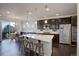 Beautiful kitchen featuring a large center island, stainless steel appliances, and modern pendant lighting at 2305 Prospect Ln, Broomfield, CO 80023