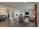 Spacious living room with ample natural light, a modern fireplace, and stylish furnishings at 2305 Prospect Ln, Broomfield, CO 80023