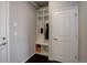 Functional mudroom with built-in shelving, storage, and a convenient coat-hanging area at 2305 Prospect Ln, Broomfield, CO 80023