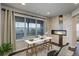 Well-lit office space with large windows and a modern fireplace at 2305 Prospect Ln, Broomfield, CO 80023