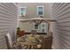 Cozy patio with a round table, umbrella, and comfortable seating at 2305 Prospect Ln, Broomfield, CO 80023