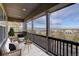 Covered patio featuring comfortable seating with a view of the city and mountains at 2305 Prospect Ln, Broomfield, CO 80023