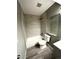 Renovated bathroom features tub with gray tiled surround at 4243 Flanders St, Denver, CO 80249
