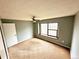 Bedroom featuring a ceiling fan and a window with a wood frame at 4243 Flanders St, Denver, CO 80249