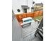 This backyard features a hot tub with built-in benches and a wood fence at 4243 Flanders St, Denver, CO 80249