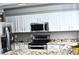 Updated kitchen with stainless steel appliances and granite countertops at 4243 Flanders St, Denver, CO 80249
