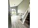 Bright living room with vaulted ceiling and sliding glass doors at 4243 Flanders St, Denver, CO 80249