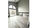 Bright living room with vaulted ceiling and sliding glass doors to the backyard at 4243 Flanders St, Denver, CO 80249