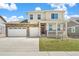 Inviting two-story home showcasing a brick-accented facade, attached three-car garage, and covered front porch at 1850 Sawtooth Mountain Dr, Berthoud, CO 80513