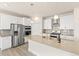 Contemporary kitchen with stainless steel appliances, sleek cabinets, and a functional island at 1850 Sawtooth Mountain Dr, Berthoud, CO 80513