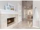 Bathroom featuring a fireplace, vanity, and access to the bath and shower at 8047 S Fairfax Ct, Centennial, CO 80122