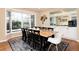 Dining room featuring a wooden table and large windows at 8047 S Fairfax Ct, Centennial, CO 80122