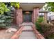 Stately brick home featuring an elegant entryway with double doors and refined details at 8047 S Fairfax Ct, Centennial, CO 80122